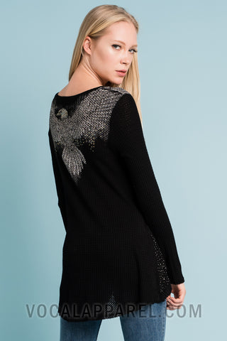 Black long sleeve high-low top with waffle-knit texture, sparkling side panel stones, and a relaxed boutique silhouette.