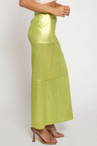 Green skirt worn by a person on a white background