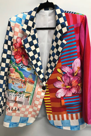 Colorful checkered blazer with floral and landscape designs on a mannequin against a white background