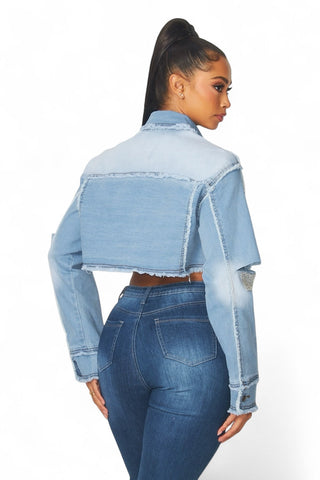 Back view of the Medley cropped denim jacket showing its cropped silhouette and rhinestone fringe details.