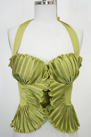 Green pleated top on a mannequin against a white background
