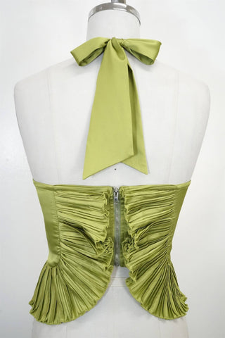 Green halter top with ruched design on a mannequin against a white background