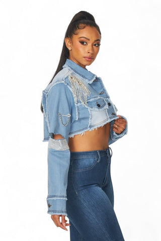 Side view of the Medley cropped denim jacket showing rhinestone fringe and a cropped hem.