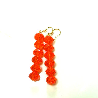 Orange crystal rondelle drop earrings with faceted beads in a linear dangle design.