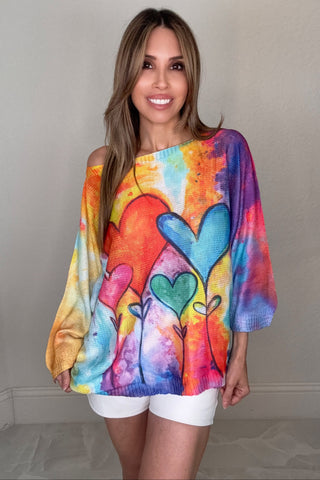 Rainbow heart graphic knit sweater with colorful rainbow tones and bold heart details on the front.