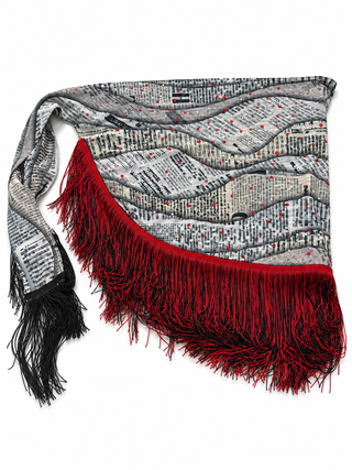 Gray abstract print rhinestone waist sash with red and black fringe on a white background