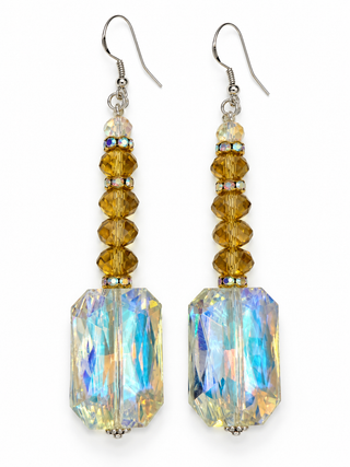 Gold and clear rectangular crystal drop earrings on a white background