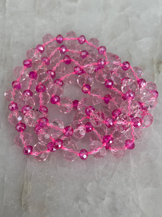 Pink crystal rondelle long necklace with faceted translucent beads and a light-catching soft pink sparkle.