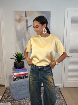 Butter yellow short sleeve tee with a relaxed drop-shoulder silhouette and clean crew neckline.
