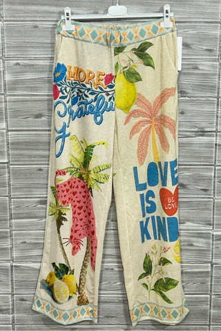 Pink Panther Graphic Knit Bottoms featuring a vivid tropical graphic print, bold illustrated motifs, patterned trim, elastic waist, and relaxed wide-leg silhouette.