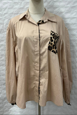Tan long sleeve button down top with a collared neckline, hidden button placket, and leopard print front pocket detail.