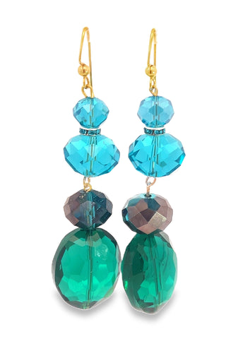 Pair of earrings with blue and green faceted beads on a white background