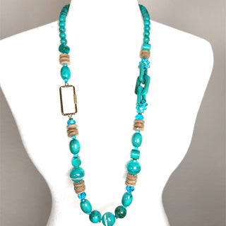 Turquoise wooden beaded necklace with natural shell accents in a single strand bohemian coastal design.