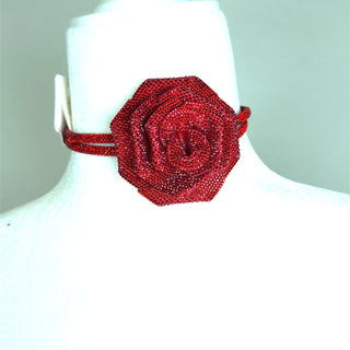 Red crystal flower choker necklace with a sculpted floral centerpiece and sparkling red embellishment.