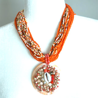 Style the Orange Beaded Shell Pendant Necklace exclusively at Born To Glam