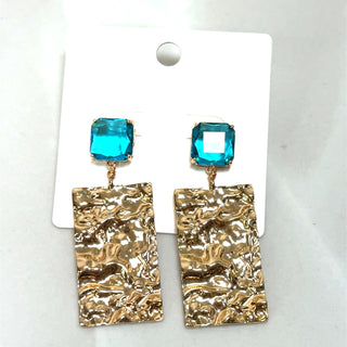 Turquoise molten gold statement earrings with textured gold rectangular drops and a bold boutique jewelry finish.