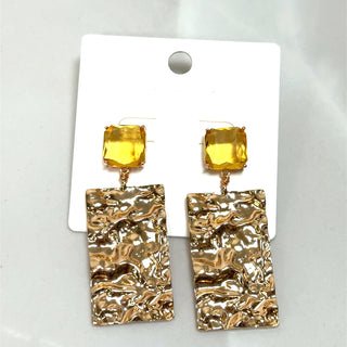 Yellow molten gold statement earrings with hammered rectangular drop pendants and clear crystal studs.