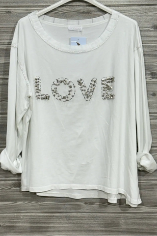 White long sleeve knit top with silver beaded LOVE lettering across the front and a relaxed draped silhouette.
