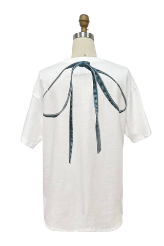 White blouse with a blue ribbon on a mannequin against a white background