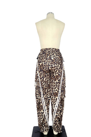 Leopard print pants on a mannequin against a white background