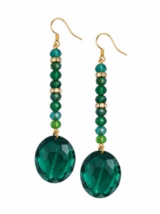 Emerald green faceted crystal long drop earrings with gold tone hooks on a white background