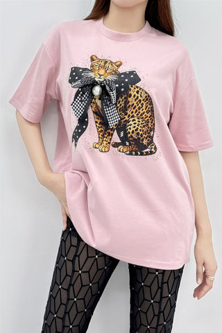 Lemon yellow oversized graphic tee featuring a bold pink leopard design with a dimensional 3D bow accent.