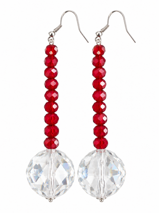 Red bead and oversized clear crystal long drop earrings with gold tone hooks on a white background