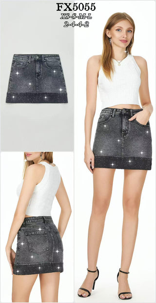 Black denim mini skirt with allover rhinestone embellishment and classic five-pocket styling.