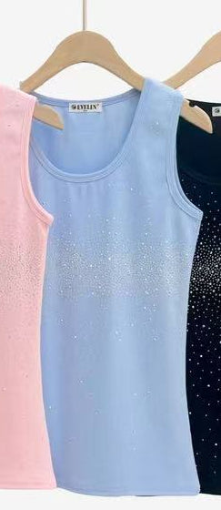 Baby blue sleeveless tank top with a scoop neckline and crystal studded front detail.